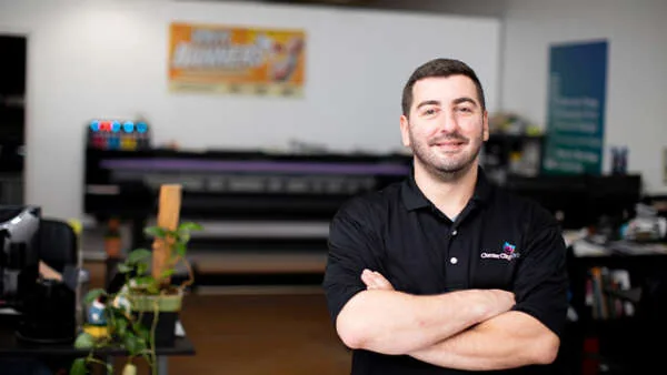 Employee handling EDDM printing and mailing