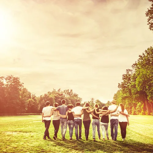 Team members with arms around each other